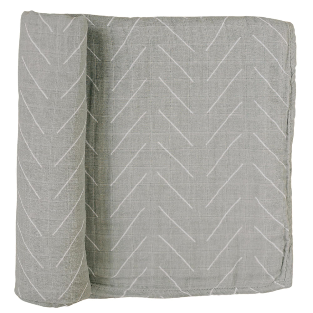 Mebie Baby Desert Sage swaddle closeup shows soft muslin texture for cozy newborn comfort.