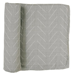 Mebie Baby Desert Sage swaddle closeup shows soft muslin texture for cozy newborn comfort.