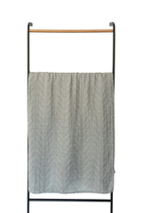 Mebie Baby swaddle in nursery setting highlights gender-neutral design for versatile decor.