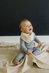 Mebie Baby muslin quilt oatmeal in nursery shows simple gender-neutral design for any room
