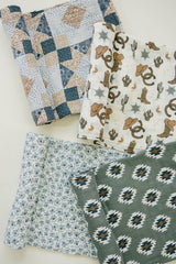 Mebie Baby Outlaw Cowboy Swaddle wrap demonstrates a secure wrap for cozy newborn cuddles.