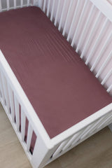 Mebie Baby Stretch Sheet Plum nursery scene highlights soft bamboo blend and modern decor compatibility.