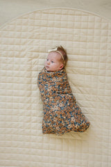 Mebie Baby Venetian Floral Swaddle wrapped around baby for secure, cozy swaddling.