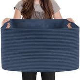 MEGASKET extra-large rectangle storage basket filled with blankets in living room.