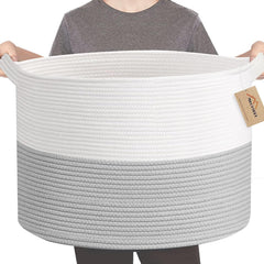MEGASKET XXXL storage bin with blankets showing large-capacity organization beside the couch.