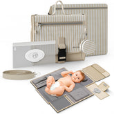 Mellories portable changing pad in beige striped opens flat for quick on-the-go diaper changes.