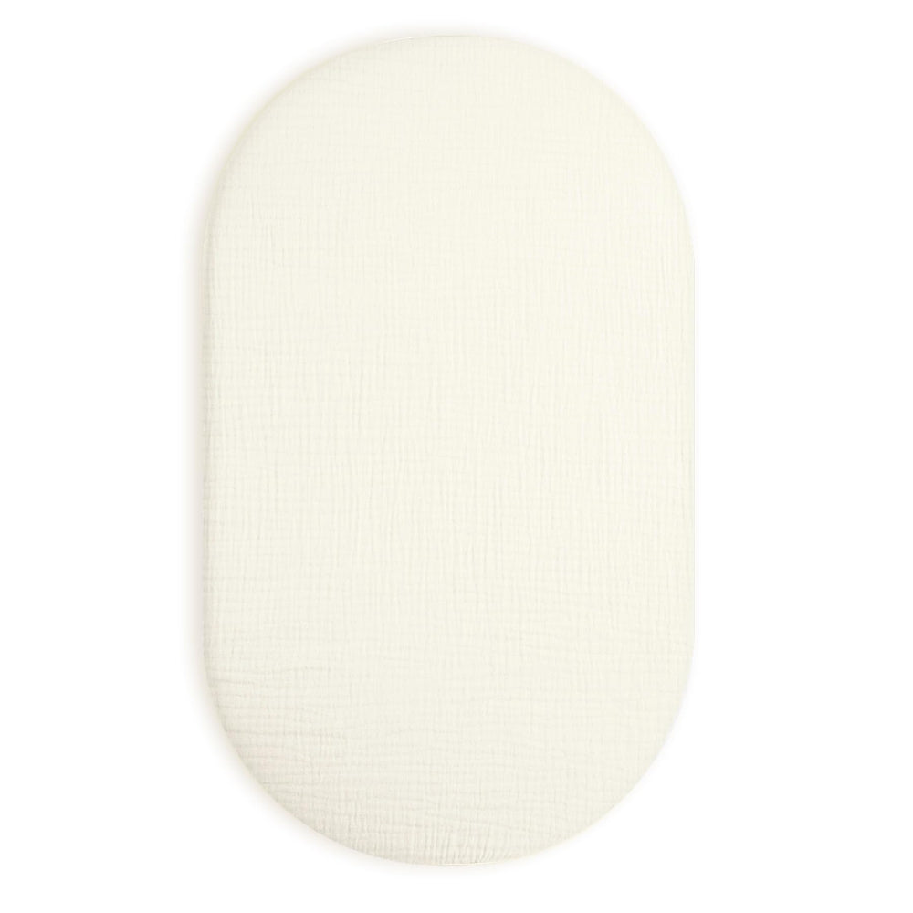 Meowcards bassinet sheet cream muslin texture close-up for breathable baby sleep