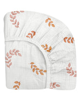 Meowcards crib sheet leaf pattern closeup showing soft, breathable muslin for baby sleep.