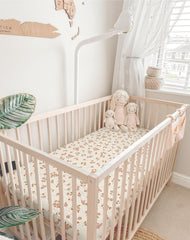 Meowcards mini crib sheets drape and snug display creates a cozy nursery vibe.