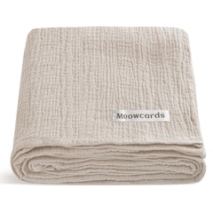 Meowcards Muslin Swaddle Blanket close-up shows ultra-soft double muslin texture for newborn comfort.