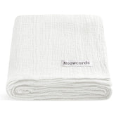 Meowcards muslin swaddle blanket white flat lay highlights breathable, ultra-soft fabric