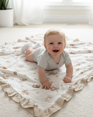 Meowcards swaddle with ruffled edges detail highlights chic, boutique-inspired nursery accessory.