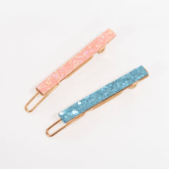 Meri Meri Rainbow Hair Clip closeup shows chunky glitter fabric and color sparkle.