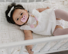 Mila & Lulu seamless design pacifier reduces crevices for easier cleaning and hygiene.