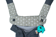 Mila Millie carrier protector setup shows center pad and shoulder pads for quick secure fit.
