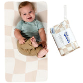 Miles of Wonder portable changing mat in checkered pattern, ideal for on-the-go diaper changes.