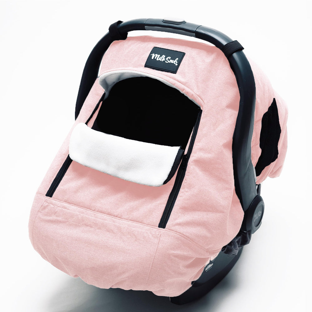 Milk Snob Winter Car Seat Cover canopy keeps baby warm with breathable design.
