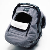 Milk Snob Winter Car Seat Cover showing waterproof outer shell protecting baby from wind and rain on outings