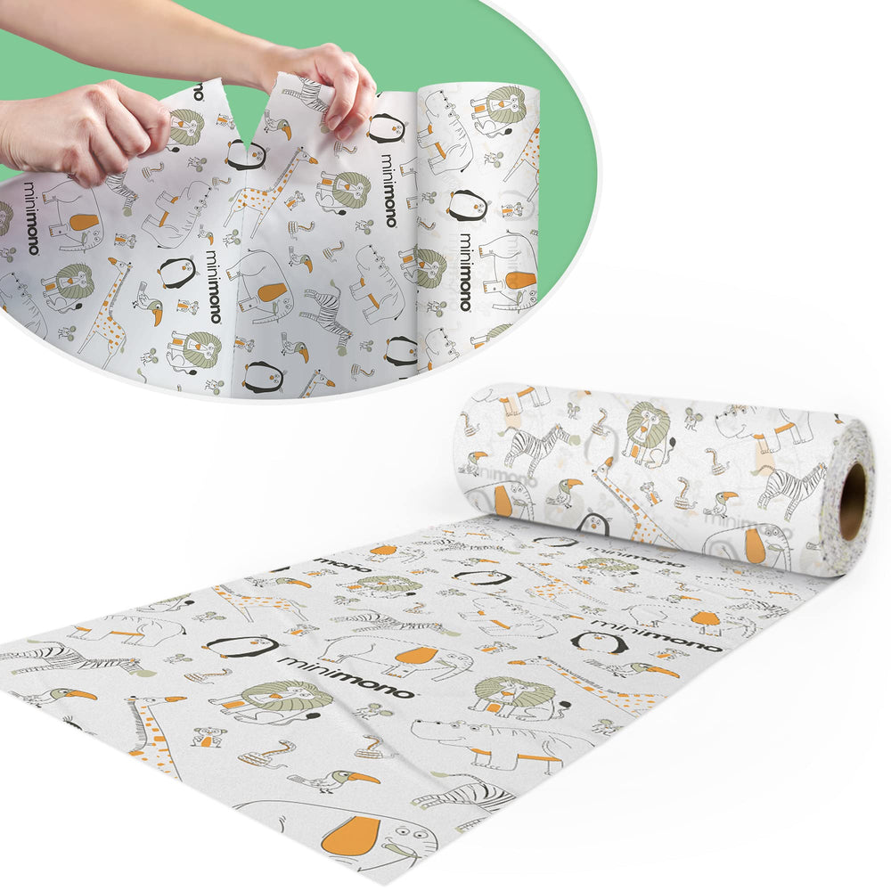 Minimono baby splat mat under high chair rolled for quick setup and protection.
