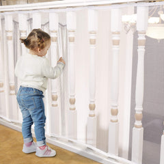 Minne Baby Banister Guard net assembly demonstrates easy length adjustment for various banister heights.