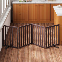 Mino Kesper freestanding dog gate in brown bamboo blocks doorways without drilling.