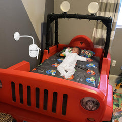 Mippko wall mount in use on wall shows elevated, unobstructed baby view.