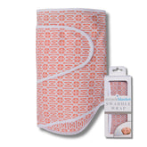 Miracle Blanket Swaddle Wrap Coral Lattice close-up shows cozy fabric for calm newborn sleep