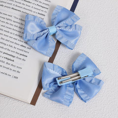 Miroksh antique blue satin bow clip in alligator style, perfect for ponytails.