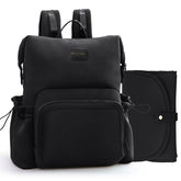 Miss Fong diaper bag backpack front pocket enables one-handed access.