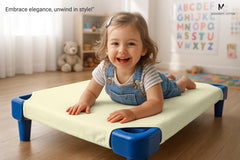 Mississippi Cotton daycare cot sheets elastic corner straps on a bed, secure fit during naps.