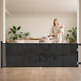 Miumoon retractable baby gate fully extended showing wide coverage and smooth operation.