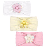 MIUXUESO beige flower headband—soft nylon for gentle all-day wear on babies