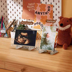 Mlatnod magnetic-closure dual frame holds two ultrasound photos securely.