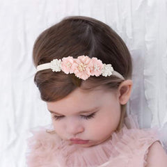 mligril crown-inspired headband on a toddler demonstrates soft comfort that stays in place.