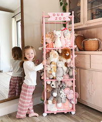 Mloong stuffed animal zoo storage pink-wood nursery decor in a cozy room