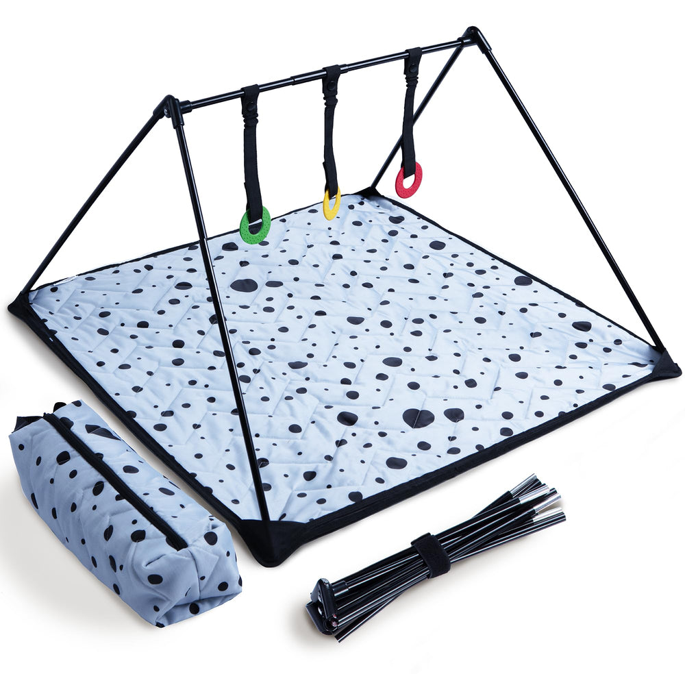 The Modern Ohana travel baby play mat folded, compact for park trips.