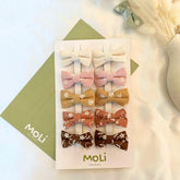 MoLi Baby Collection 10-piece floral bow clips in autumn tones for easy daily styling.