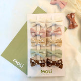 MoLi Baby Collection bowclips earth tones for everyday outfits with gentle, secure hold.