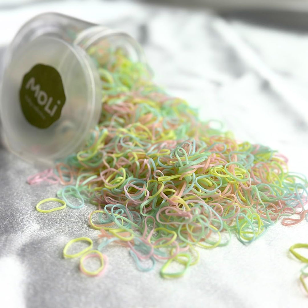 MoLi Baby Collection box close-up showing 1500 soft hair elastics for delicate toddler hair.