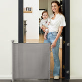 Momcozy auto lock retractable gate extended to 55 inches for wide doorways and stairs.