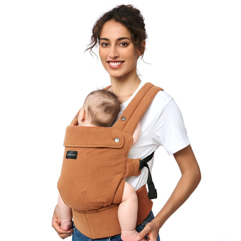 Momcozy baby carrier in natural cotton linen worn for all-day comfort.