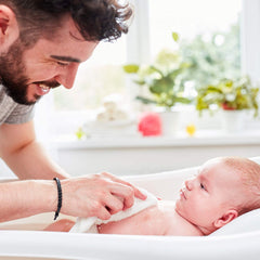 Momcozy baby washcloth close-up illustrating quick-drying, gentle cleansing