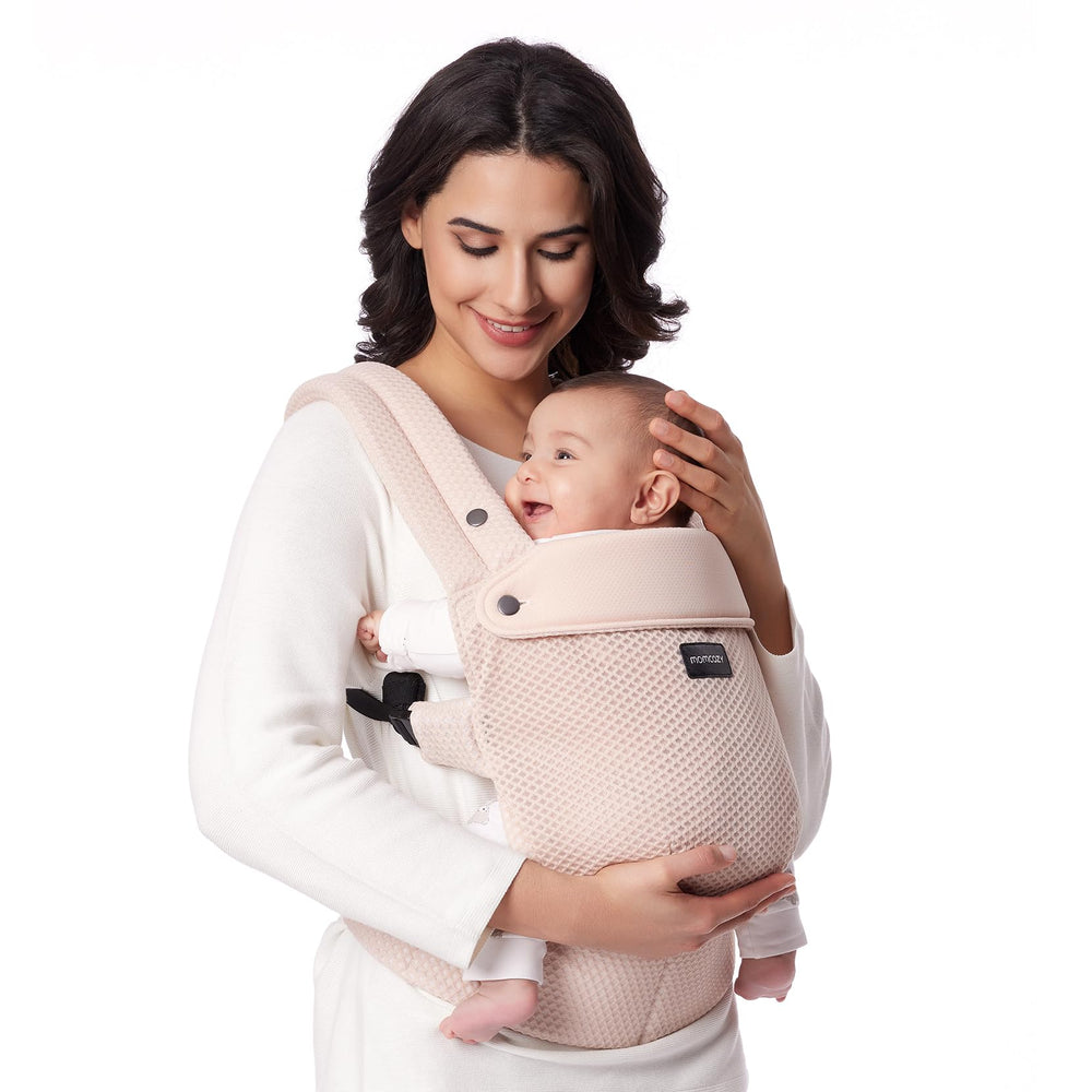 Momcozy breathable mesh baby carrier with air mesh panel promotes cool, dry wear for parent and baby.