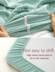 Momcozy crib-sheet-breathable-fabric highlights air-permeable texture for baby comfort.