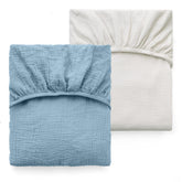 Momcozy muslin fitted crib sheet 52x28 pack shows a soft breathable surface for baby sleep.