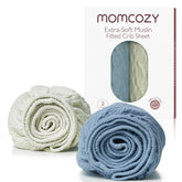 Momcozy muslin mini crib sheets two-pack—soft 100% cotton for delicate baby skin.