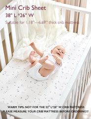 Momcozy Muslin Mini Crib Sheets on a crib mattress, soft breathable cotton
