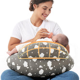 Momcozy Original nursing pillow safety fence close-up showing secure cradle for baby.