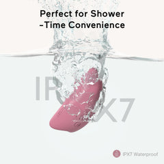 Momcozy massager in shower demonstrating IP27 waterproof design.