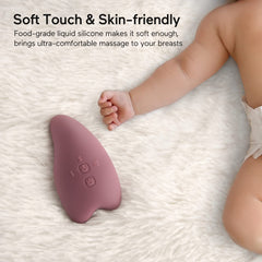 Momcozy massager in action with soothing vibration.